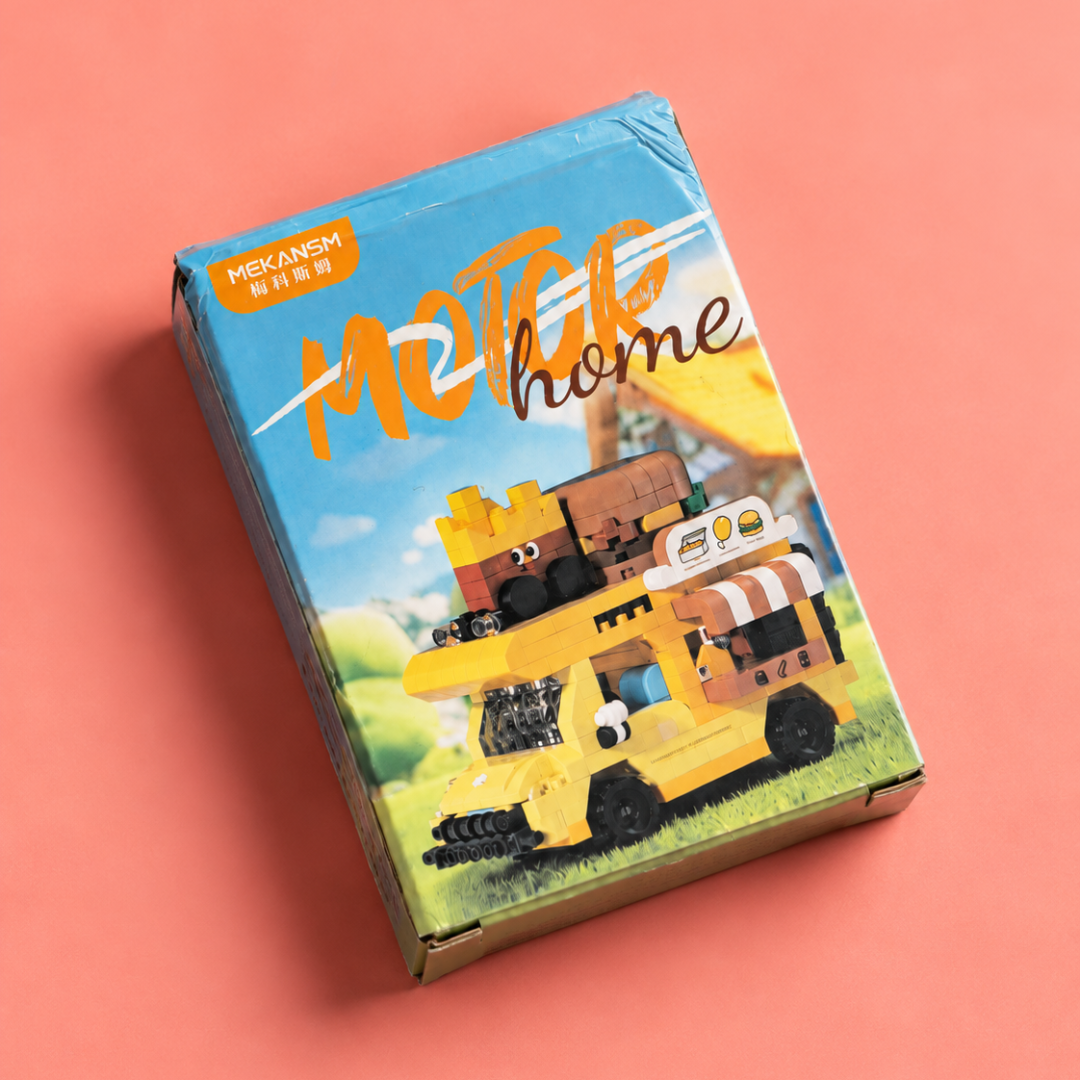 MEKANSM yellow food truck building blocks box shown at an angle